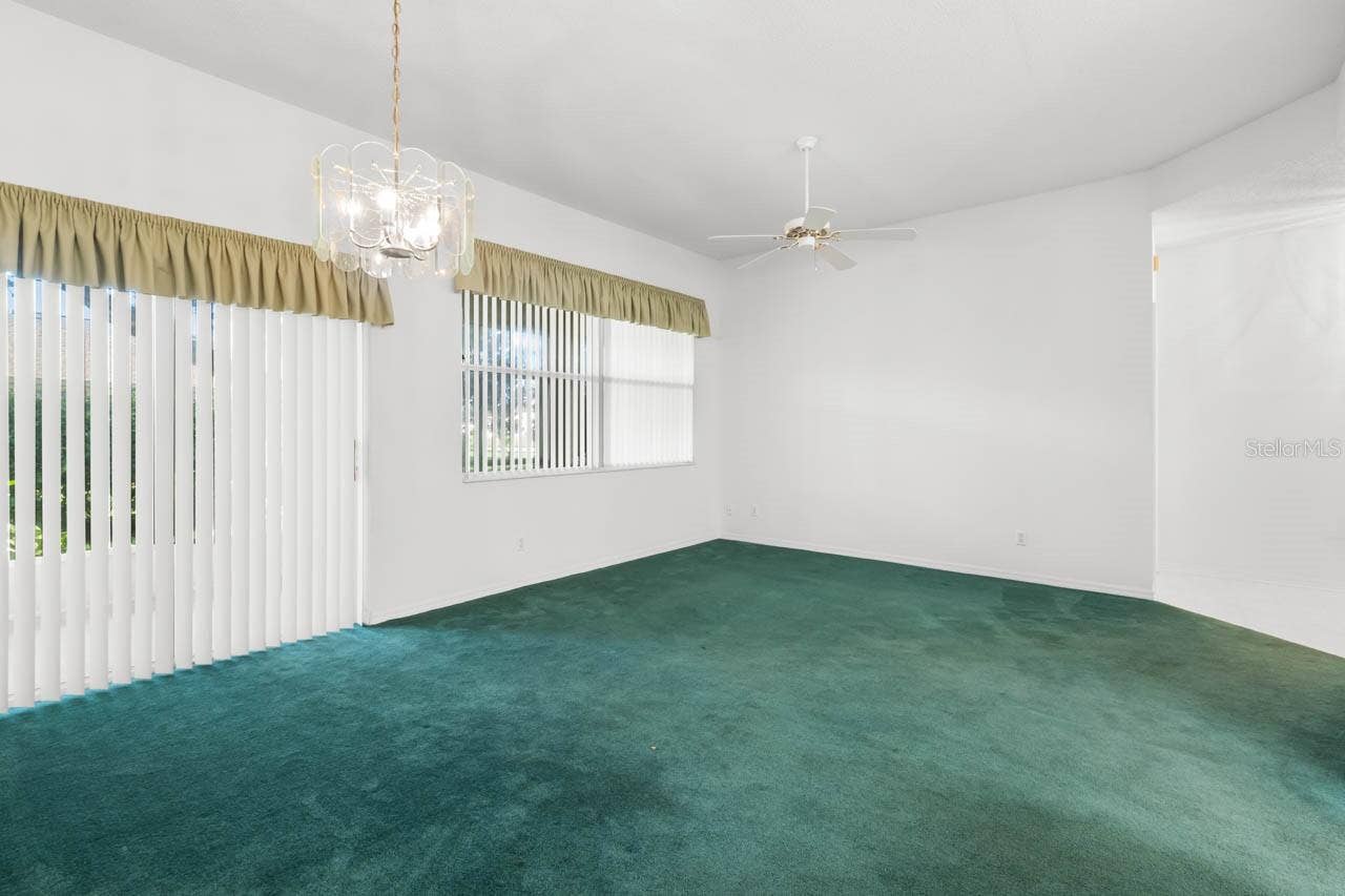 2617 NEWCOMB COURT, Sun City Center, FL 33573 Great room with sliders to the screened lanai