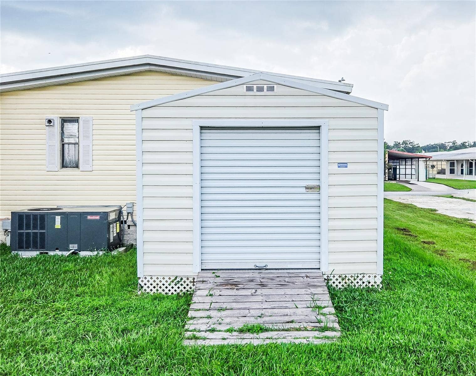 5716 PAWNEE STREET, Zephyrhills, FL 33542 storage/ cart parking
