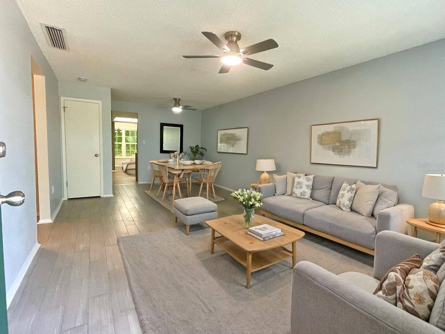 1020 85TH AVENUE N, #222, St Petersburg, FL 33702 Virtually staged-living room and dining area.