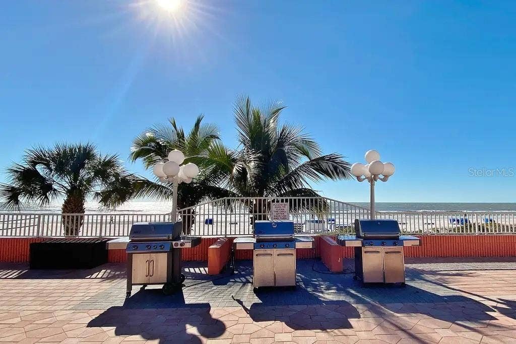 18400 GULF BOULEVARD, #1208, Indian Shores, FL 33785 GAS GRILLS LOCATED ON POOL DECK, PERFECT FOR PREPARING AND ENJOYING MEALS WITH BREATHTAKING BEACH VIEWS.