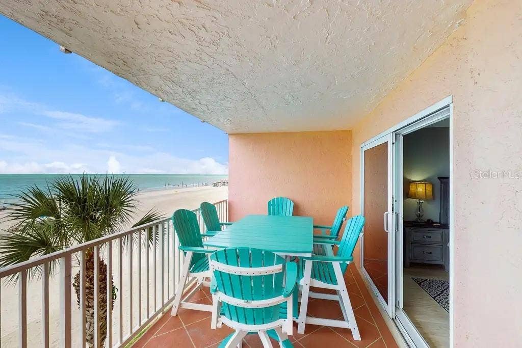 18400 GULF BOULEVARD, #1208, Indian Shores, FL 33785 PRIVATE BALCONY OVERLOOKING THE BEACH, OFFERS DIRECT ACCESS FROM THE GREAT ROOM AND PRIMARY BEDROOM.