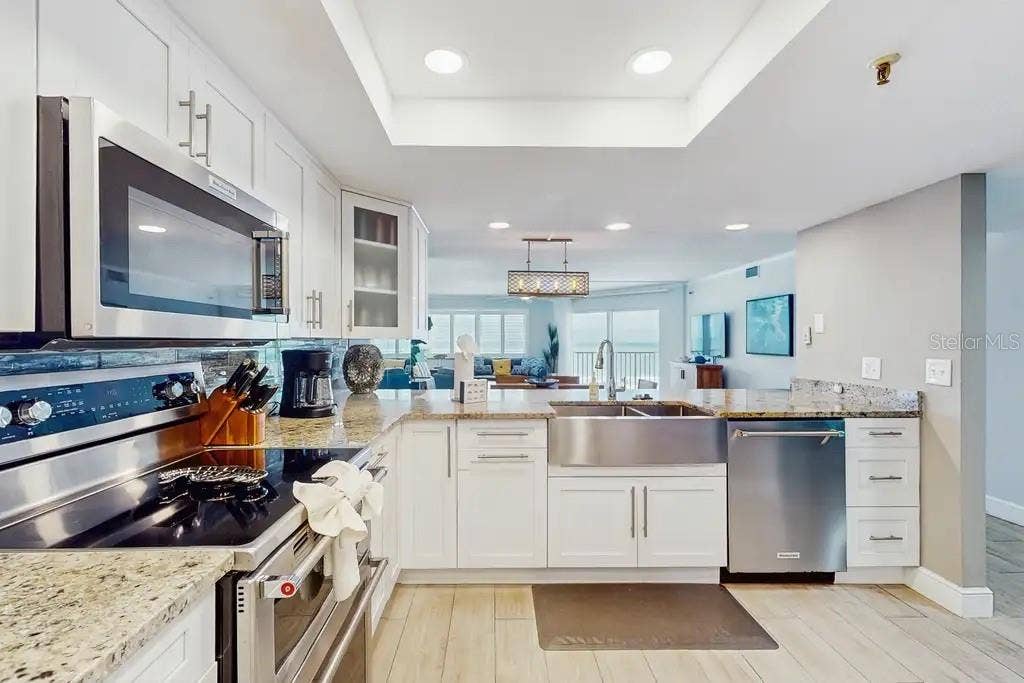 18400 GULF BOULEVARD, #1208, Indian Shores, FL 33785 STATE-OF-THE-ART KITCHEN FEATURING STAINLESS STEEL APPLIANCES AND DOUBLE OVEN