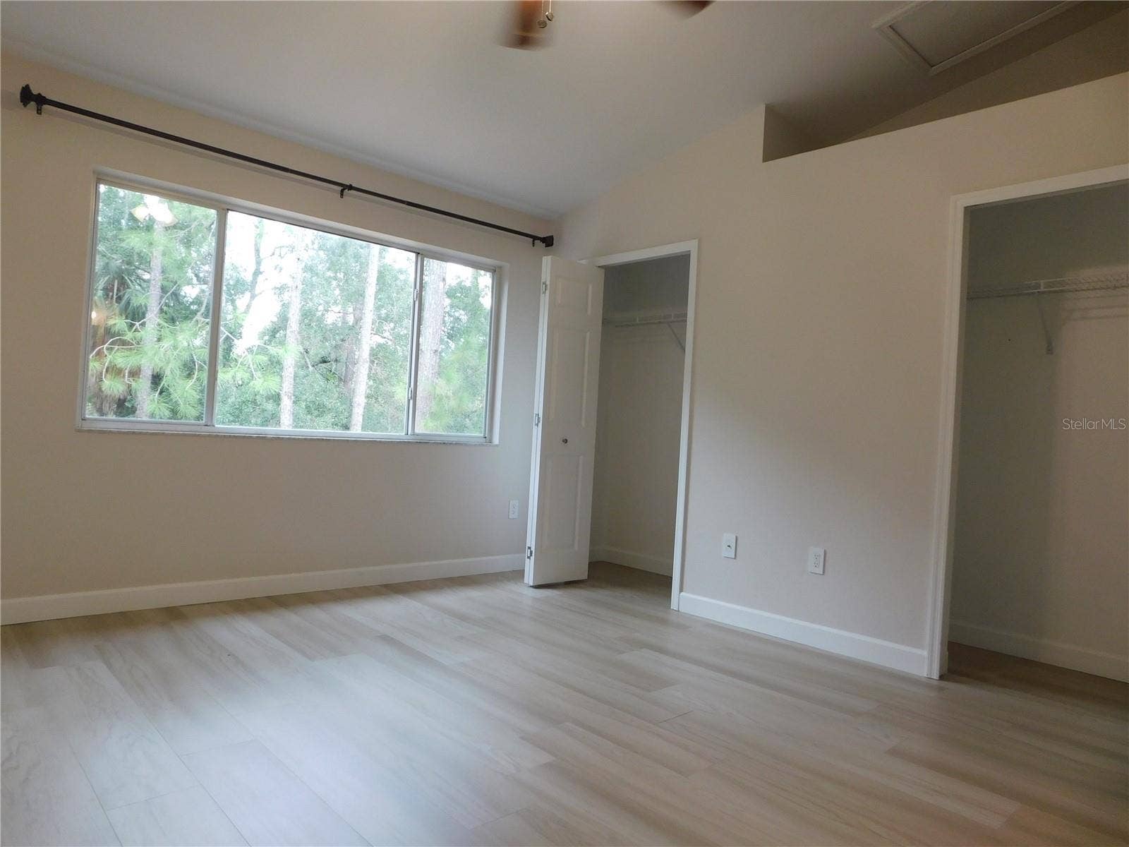 8660 HUNTERS KEY CIRCLE, Tampa, FL 33647 Primary 1 LVP Flooring - conservation view - Dual Closets - Vaulted ceiling - Remodeled adjoining bathroom