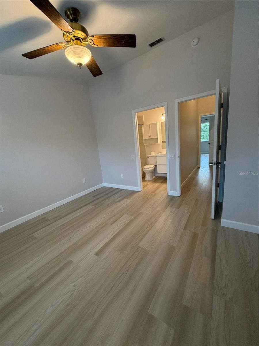 8660 HUNTERS KEY CIRCLE, Tampa, FL 33647 Primary 2 LVP Flooring - Vaulted ceiling - Remodeled adjoining bathroom