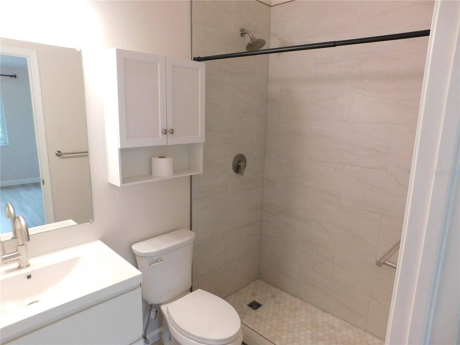 8660 HUNTERS KEY CIRCLE, Tampa, FL 33647 Primary 1 New Remodel Ensuite - Flooring, Shower tiles, Vanity and Faucet, Mirror, Toilet and Light Fixture.