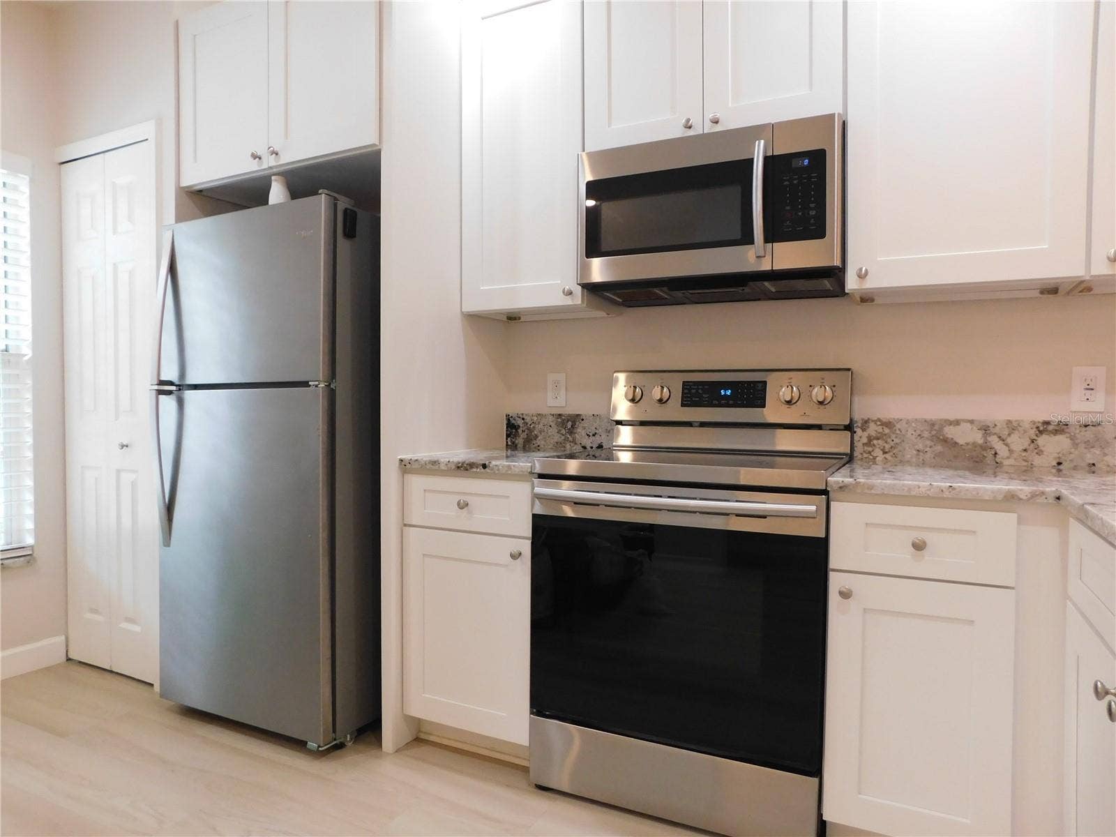 8660 HUNTERS KEY CIRCLE, Tampa, FL 33647 Remodeled Kitchen with new cabinets, gorgeous Granite counters and large ss deep sink.
