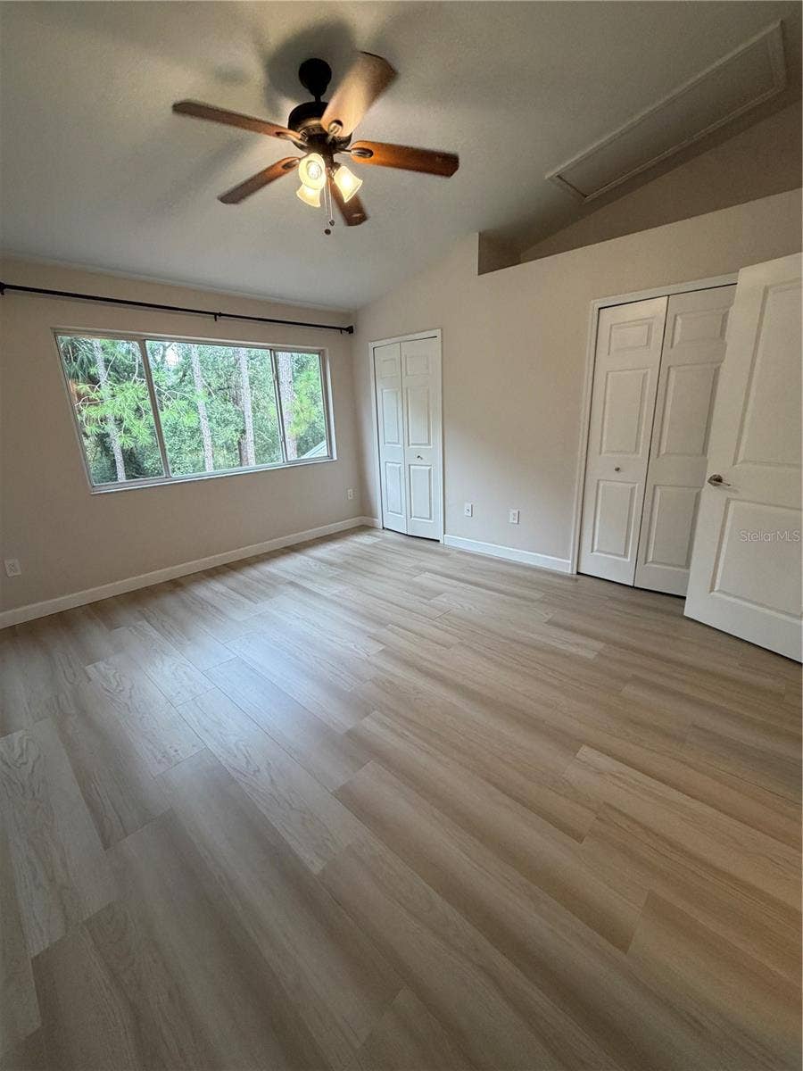 8660 HUNTERS KEY CIRCLE, Tampa, FL 33647 Primary 1 LVP Flooring - conservation view - Dual Closets - Vaulted ceiling - Remodeled adjoining bathroom