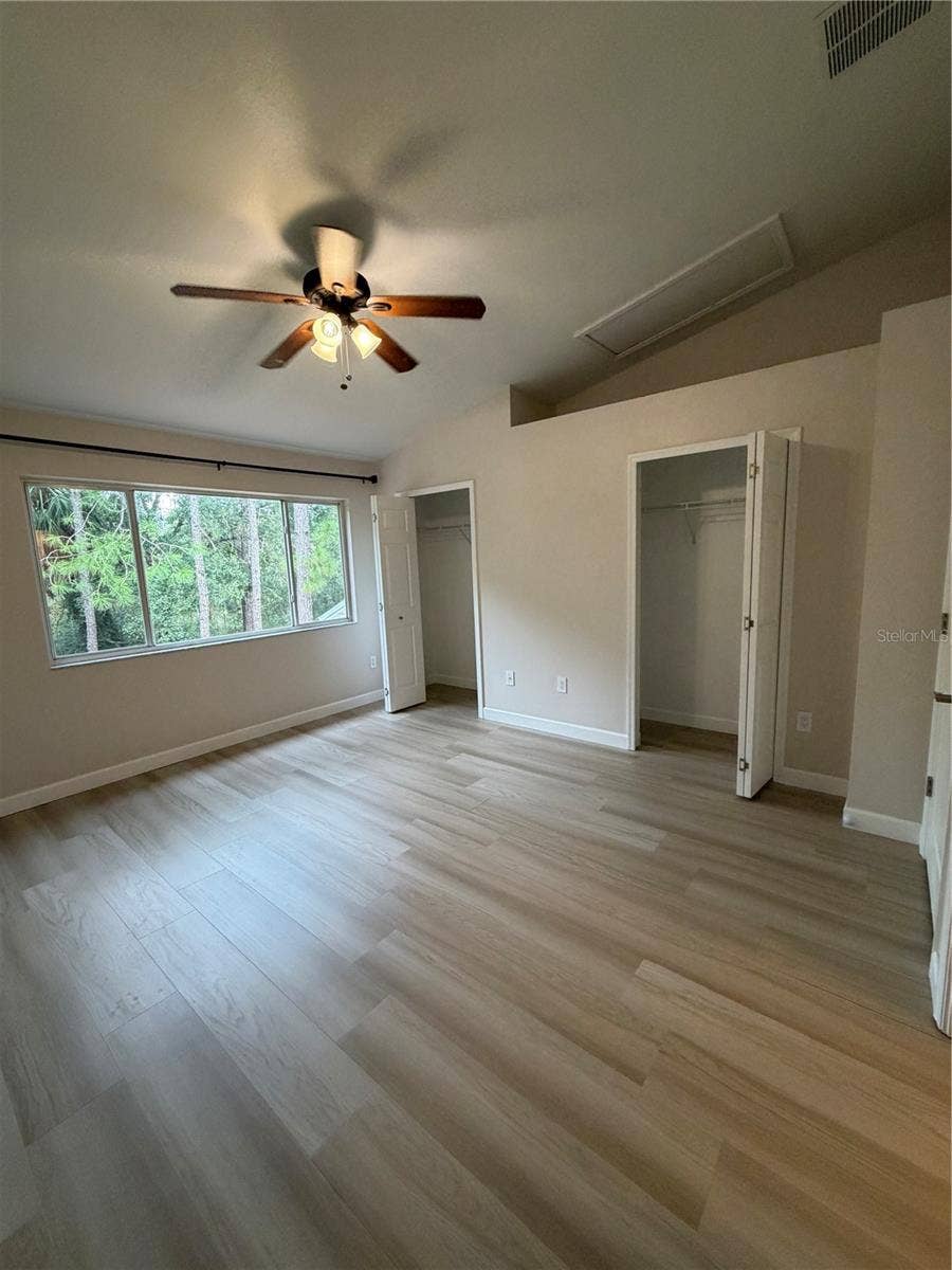 8660 HUNTERS KEY CIRCLE, Tampa, FL 33647 Primary 1 LVP Flooring - conservation view - Dual Closets - Vaulted ceiling - Remodeled adjoining bathroom