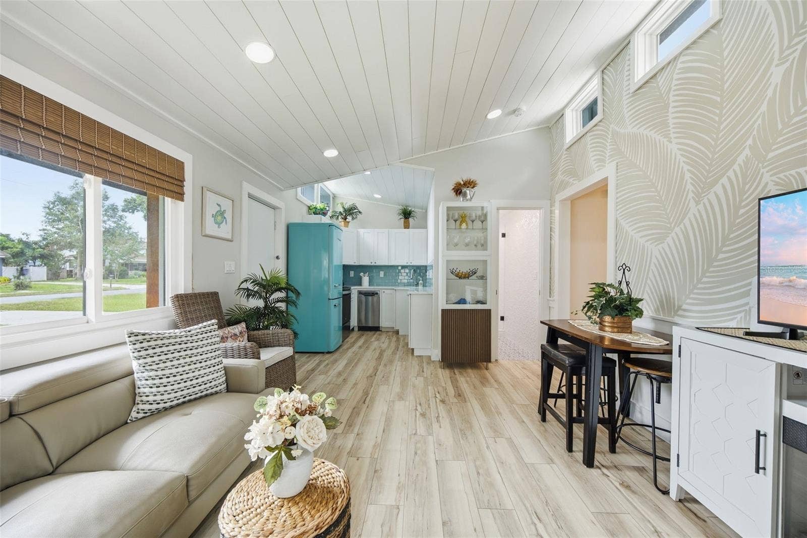 Vaulted shiplap ceilings, abundant natural light
