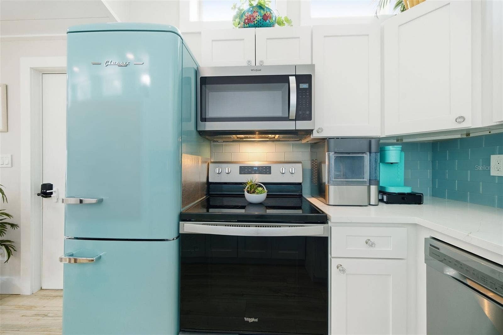 Thoughtfully equipped kitchen w/countertop ice maker and dedicated coffee station