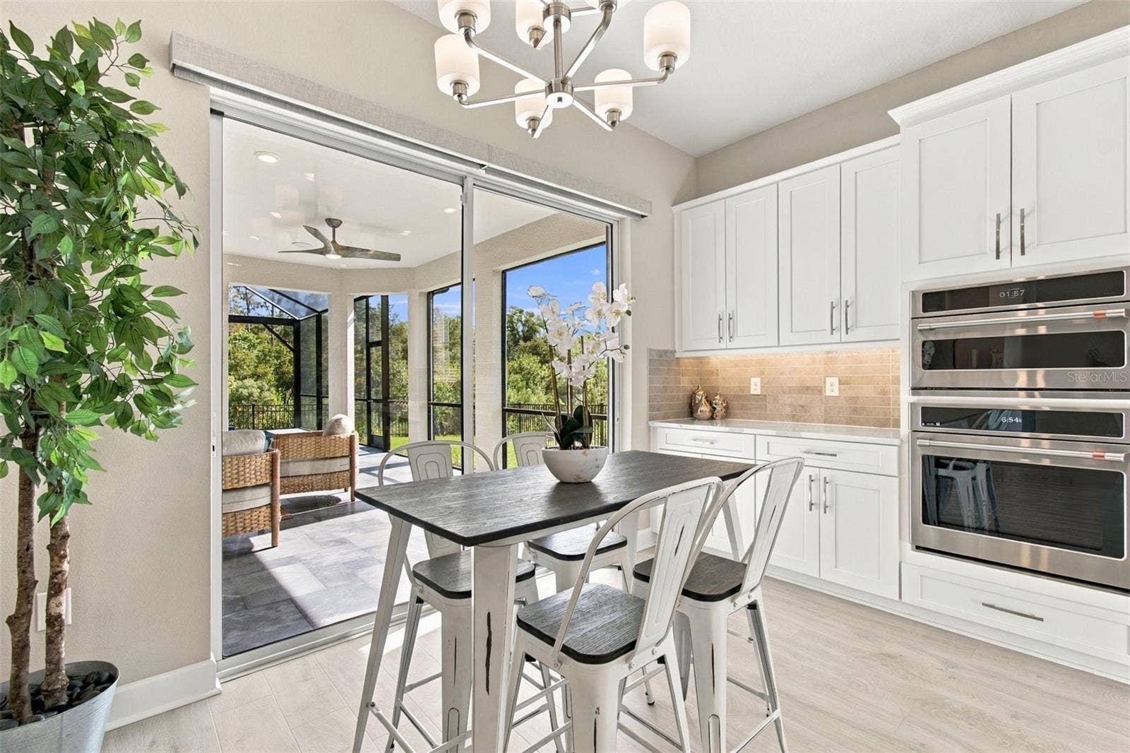 29749 CASSINO COURT, Wesley Chapel, FL 33543 Casual Dining Area overlooks pool, spa and nature