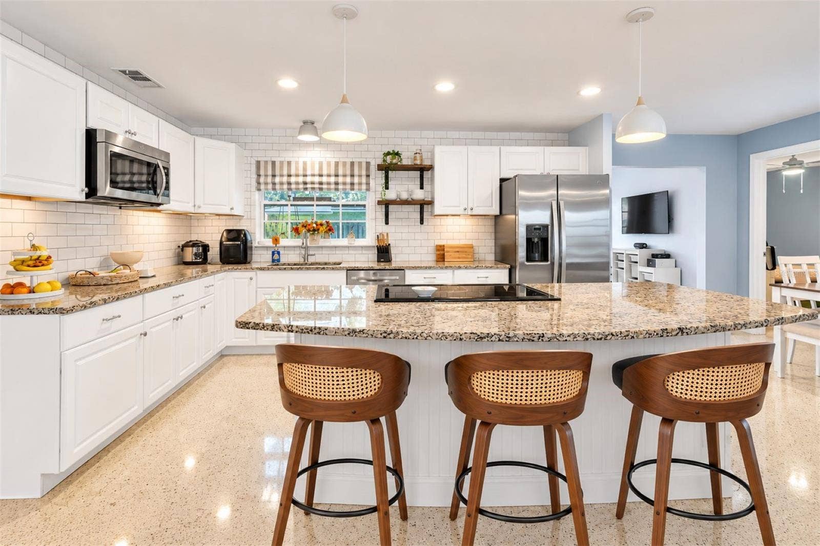5701 6TH WAY S, St Petersburg, FL 33705 Breakfast bar with pendant lighting.