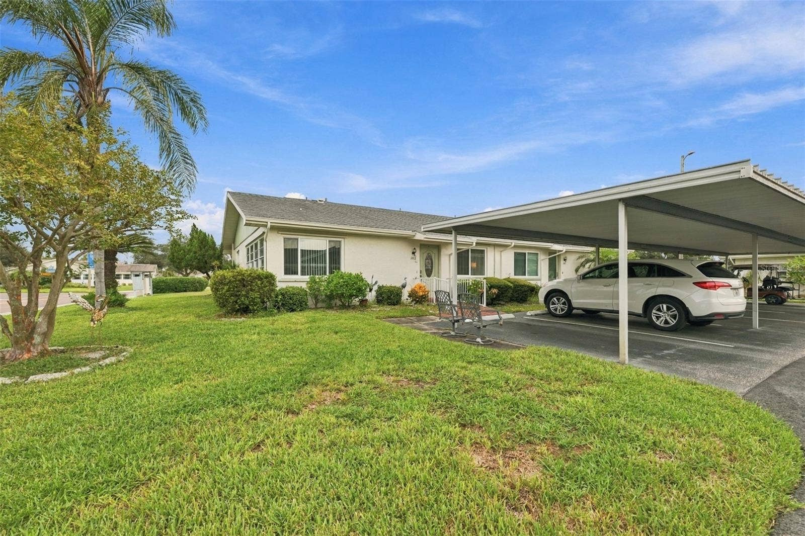 202 GLOUCESTER BOULEVARD, #357, Sun City Center, FL 33573 Car Port with 2 spaces