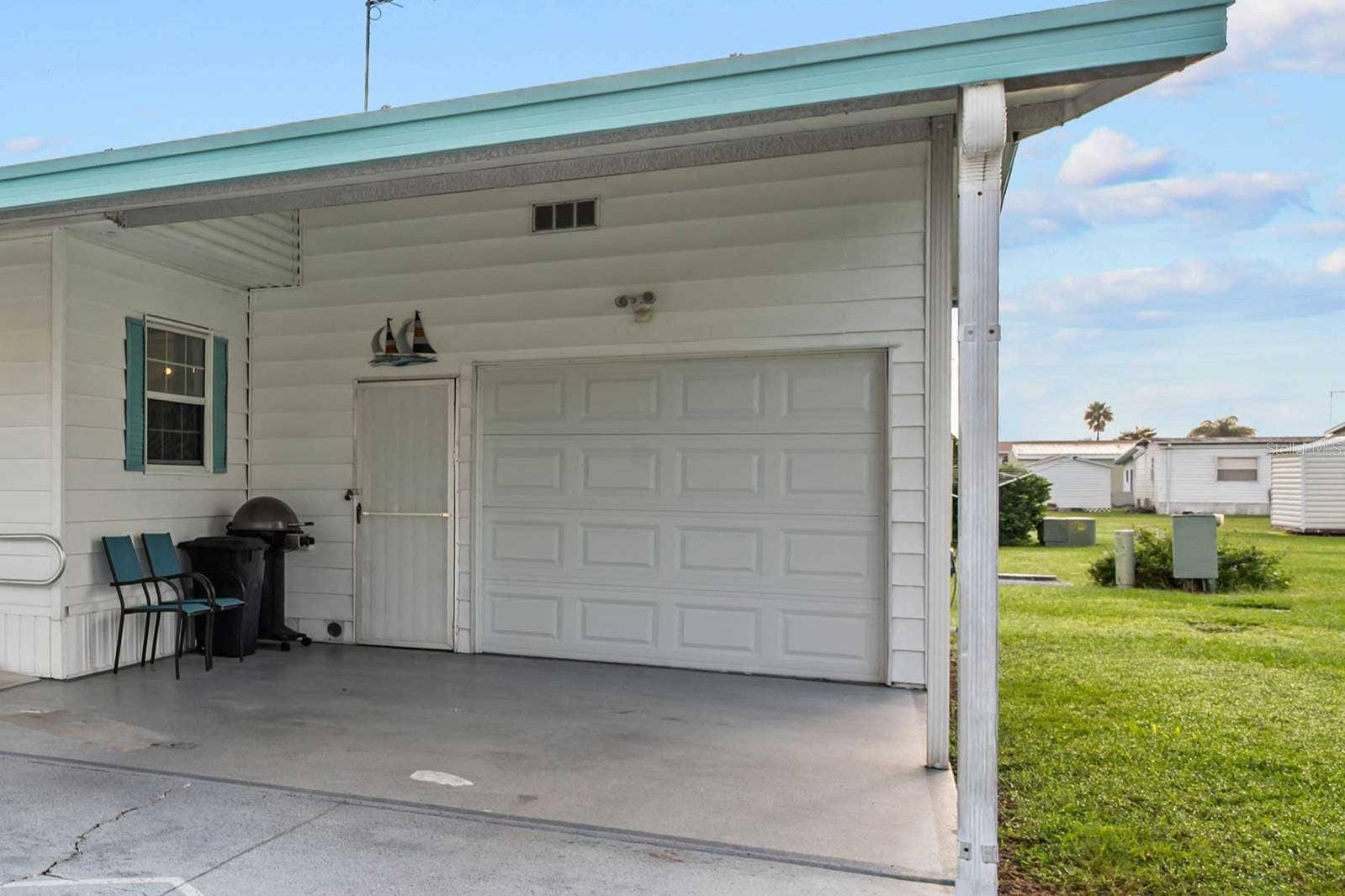 5352 PLANT STREET, Zephyrhills, FL 33542 Golf cart garage and additional storage.