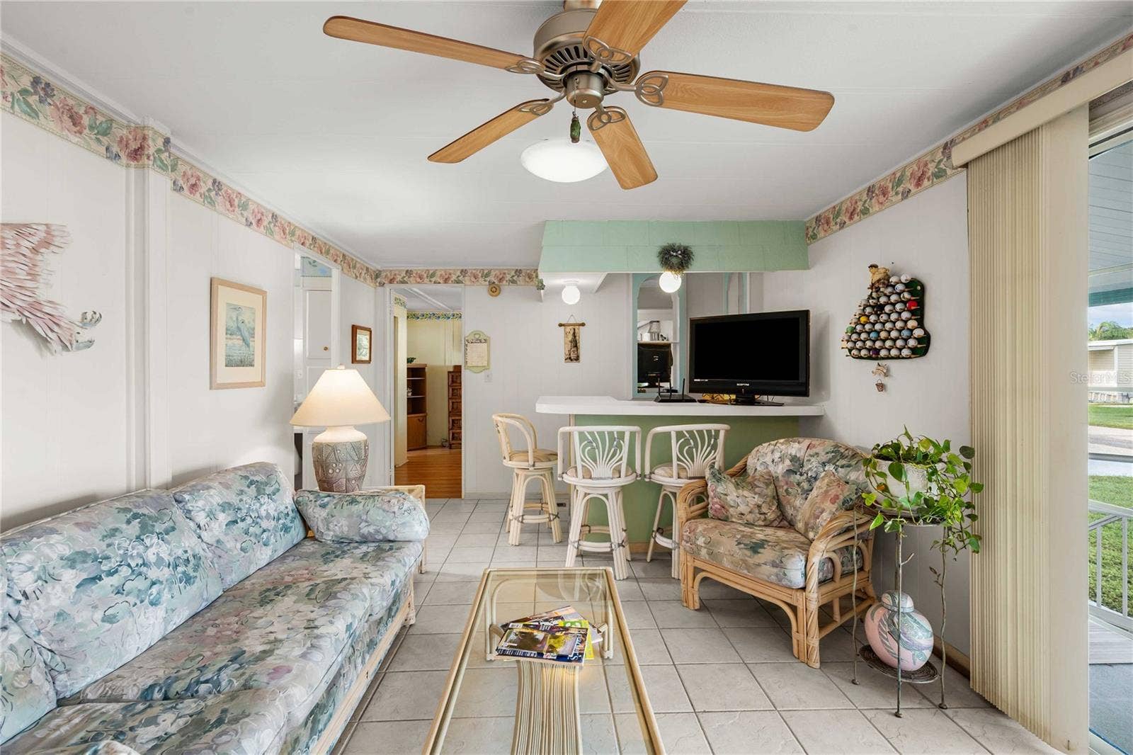 5352 PLANT STREET, Zephyrhills, FL 33542 Family room is open with the kitchen.