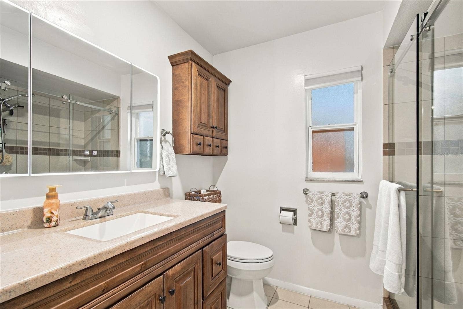 14304 91ST AVENUE, Seminole, FL 33776 CUSTOM CABINETRY IN ENSUITE BATHROOM