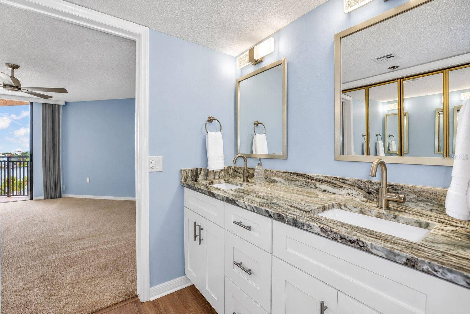 690 ISLAND WAY, #606, Clearwater, FL 33767 Updated primary bathroom with double vanity and closet remodel