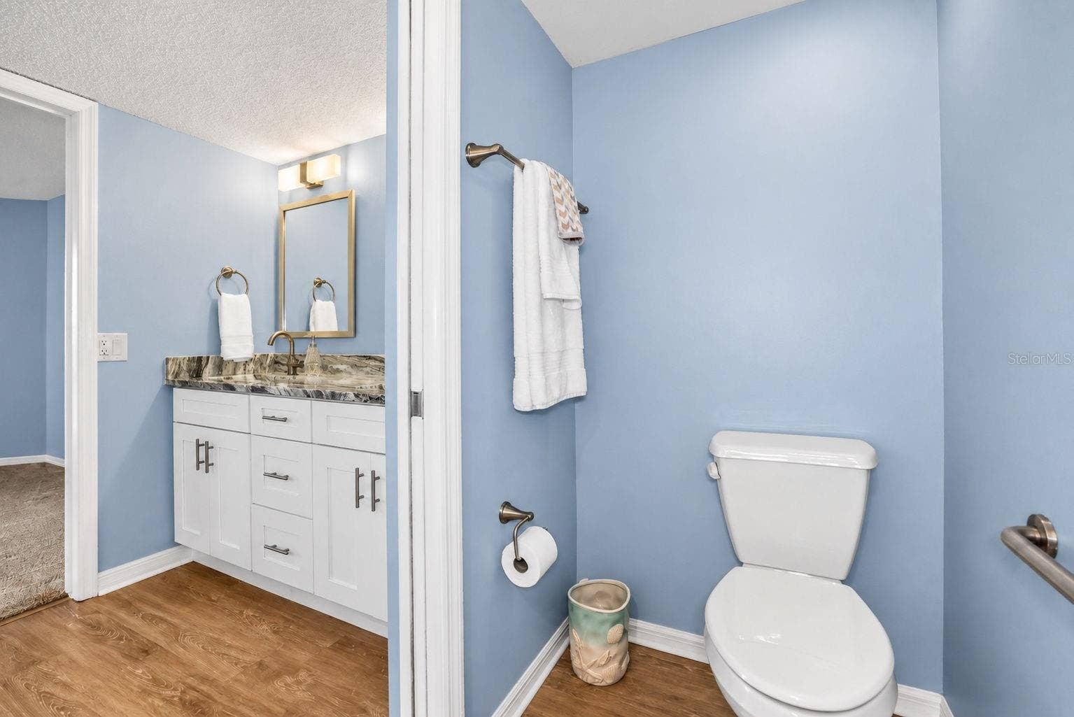 690 ISLAND WAY, #606, Clearwater, FL 33767 Primary Bathroom, newly updated with double sink shaker cabinet vanity with soft close drawers, lighting, mirrors and paint.