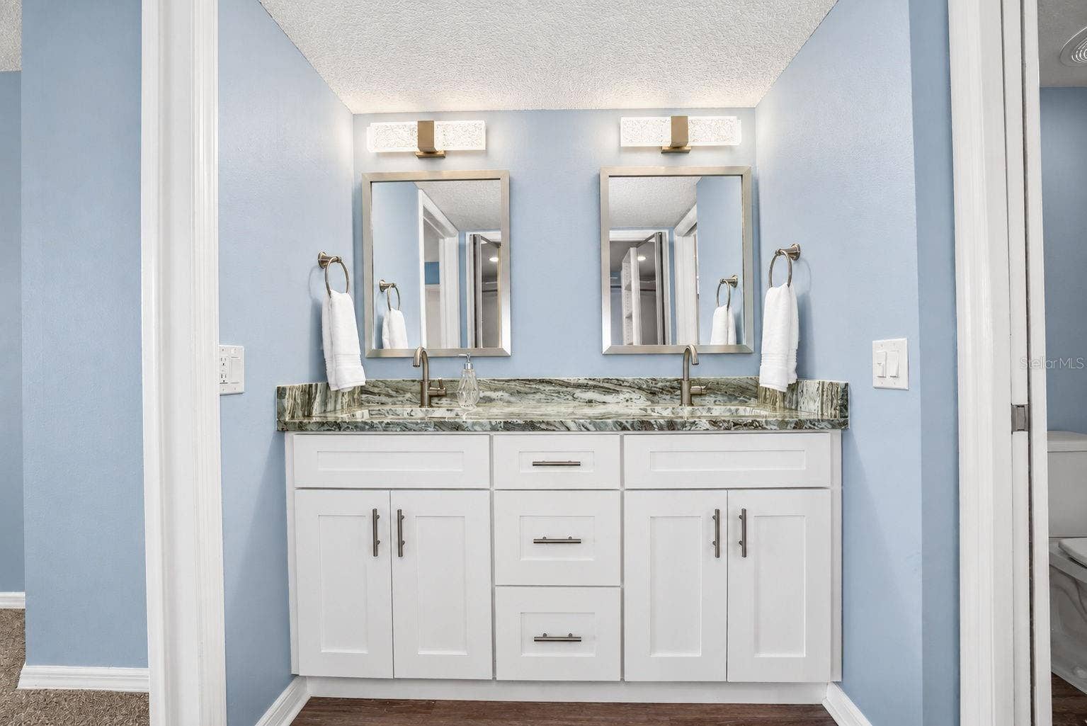 690 ISLAND WAY, #606, Clearwater, FL 33767 Primary Bathroom, newly updated with double sink shaker cabinet vanity with soft close drawers, lighting, mirrors and paint.