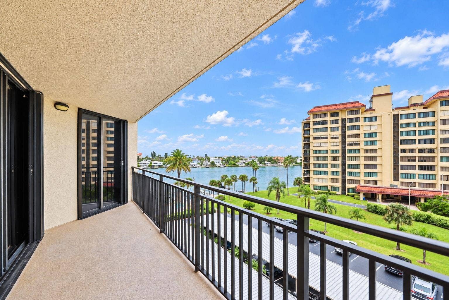 690 ISLAND WAY, #606, Clearwater, FL 33767 Large Patio undercover. New railings and non-skid flooring. I've seen dolphins from here. Facing West