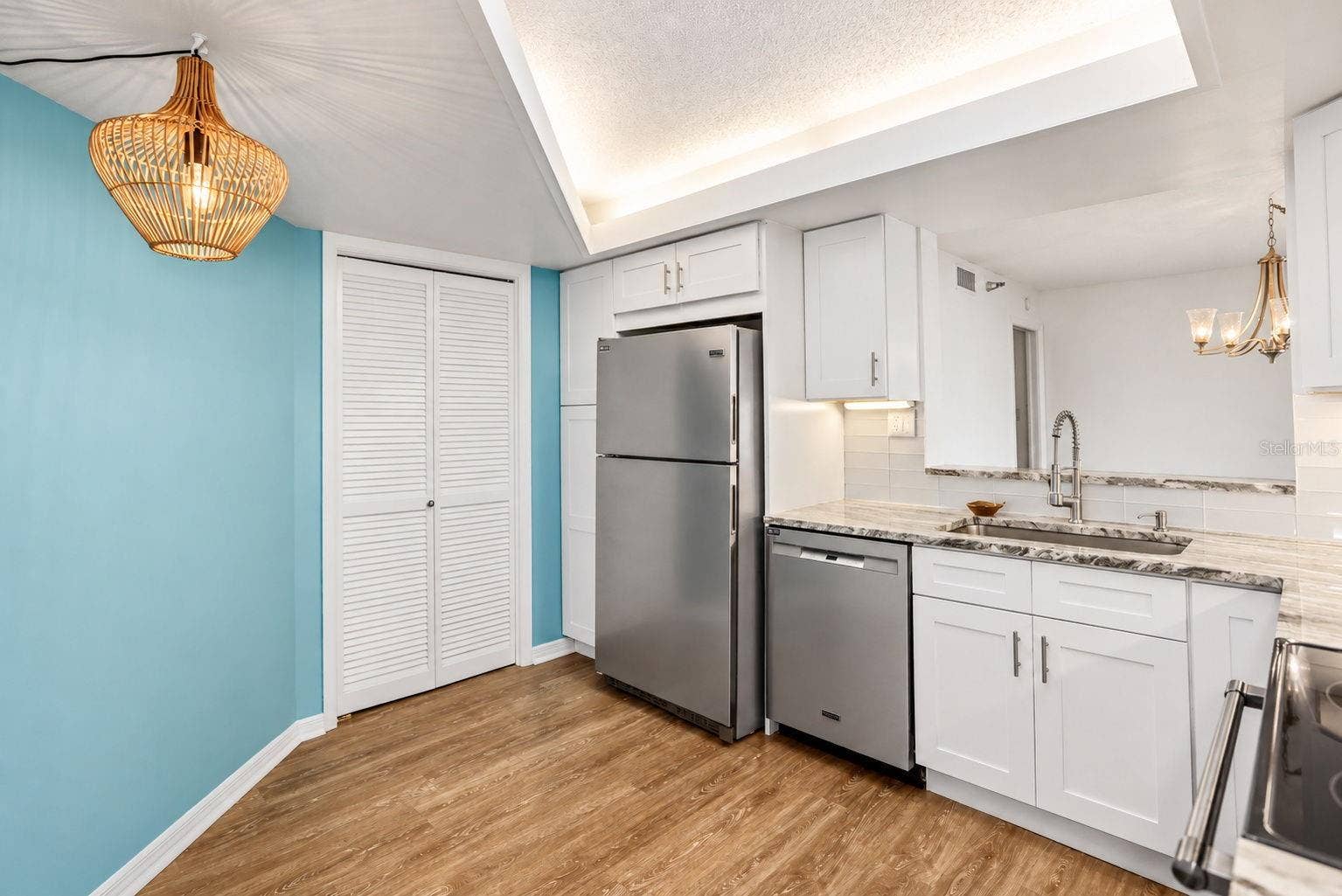 690 ISLAND WAY, #606, Clearwater, FL 33767 Kitchen remodel includes pantry closet and extra pantry next to the refrigerator.