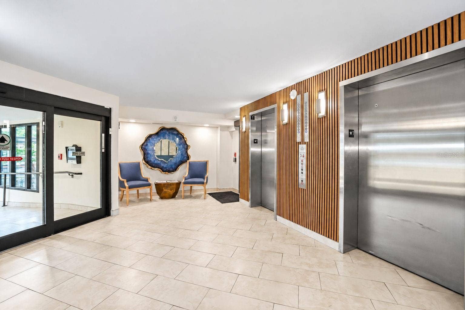 690 ISLAND WAY, #606, Clearwater, FL 33767 Lobby update showing 2 elevators. The building has a generator to run elevators in case of power outage.