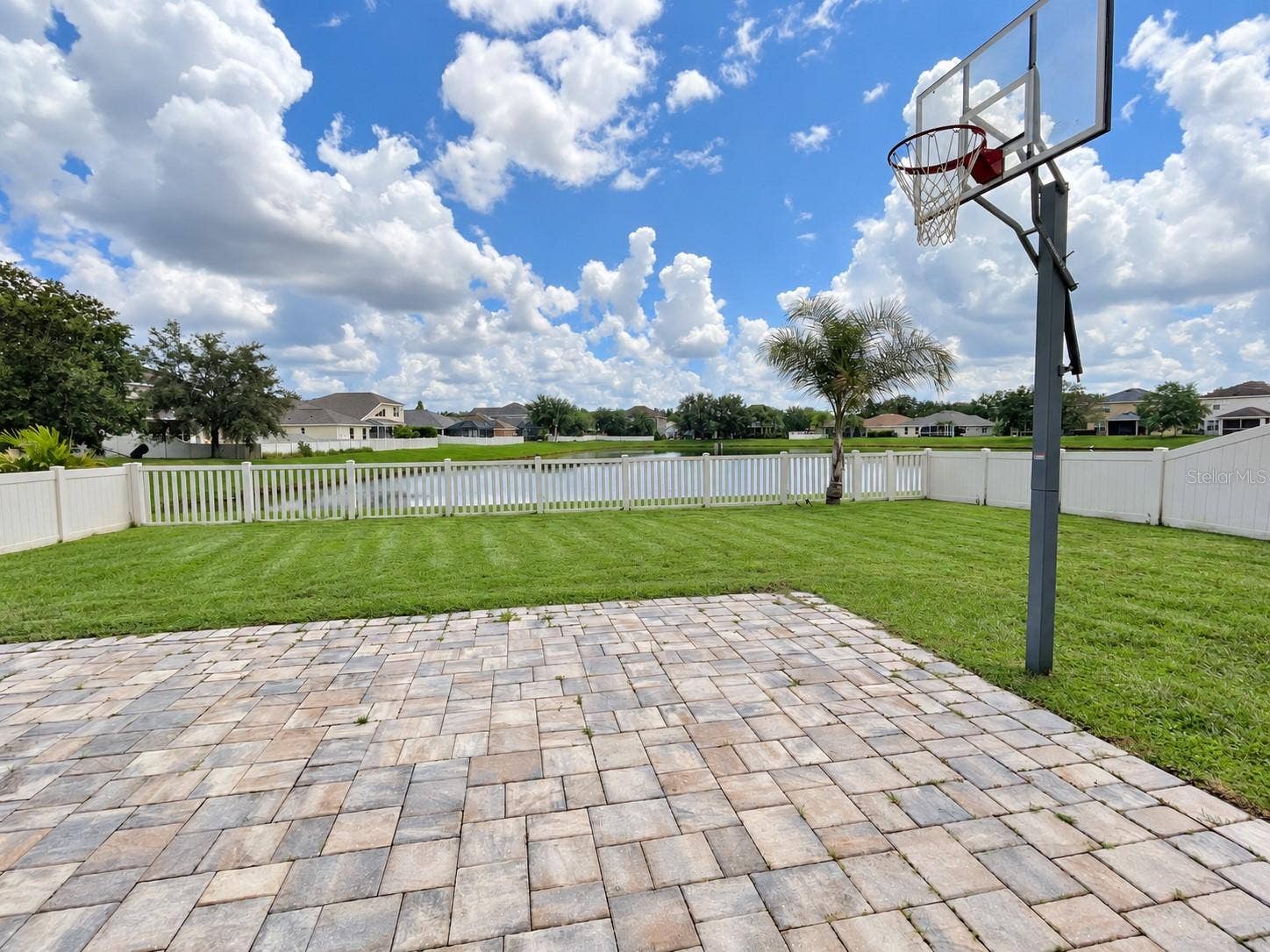 Enjoy a fully fenced backyard with peaceful pond views and a spacious lawn for outdoor play.The enclosed setting offers a welcoming space for children and pets to enjoy time outdoors.