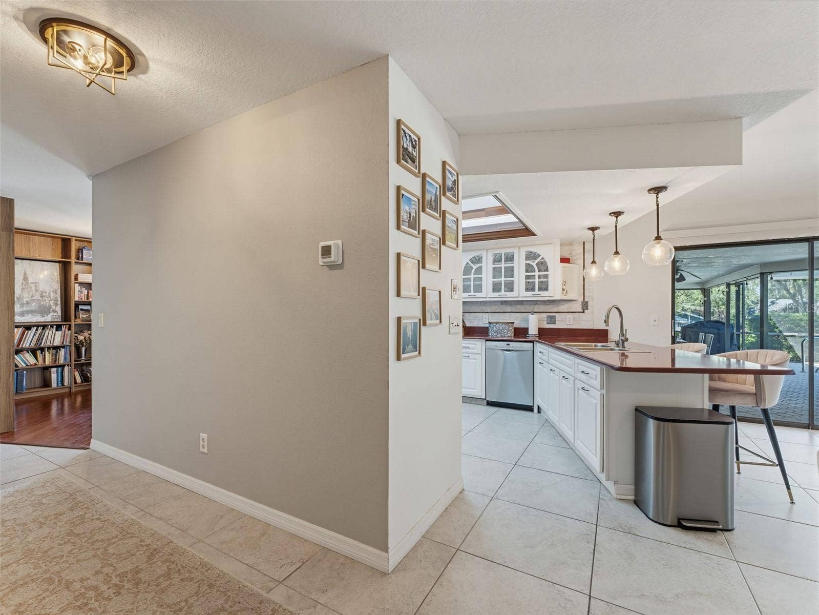 Entry to Hall and Kitchen from Dining area