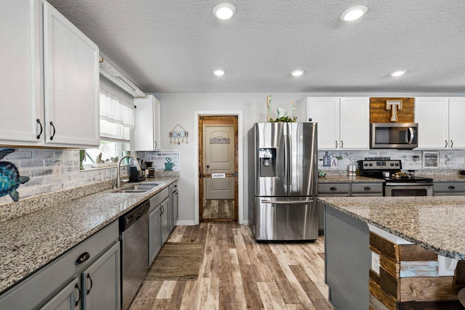 Door to laundry room, through to two car garage