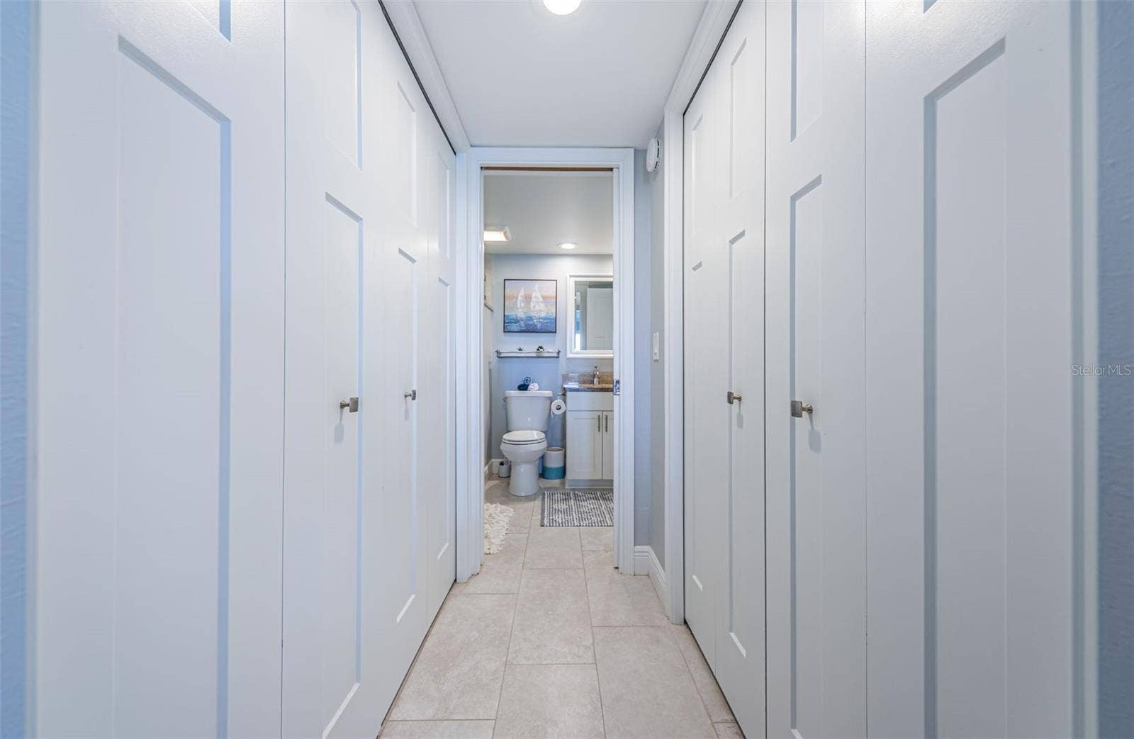 4775 COVE CIRCLE, #904, St Petersburg, FL 33708 Washer/Dryer closet on the left and walk-in closet to the right
