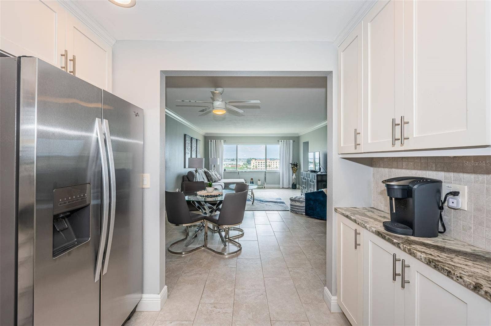 4775 COVE CIRCLE, #904, St Petersburg, FL 33708 Open kitchen with pantry and lots of cabinets
