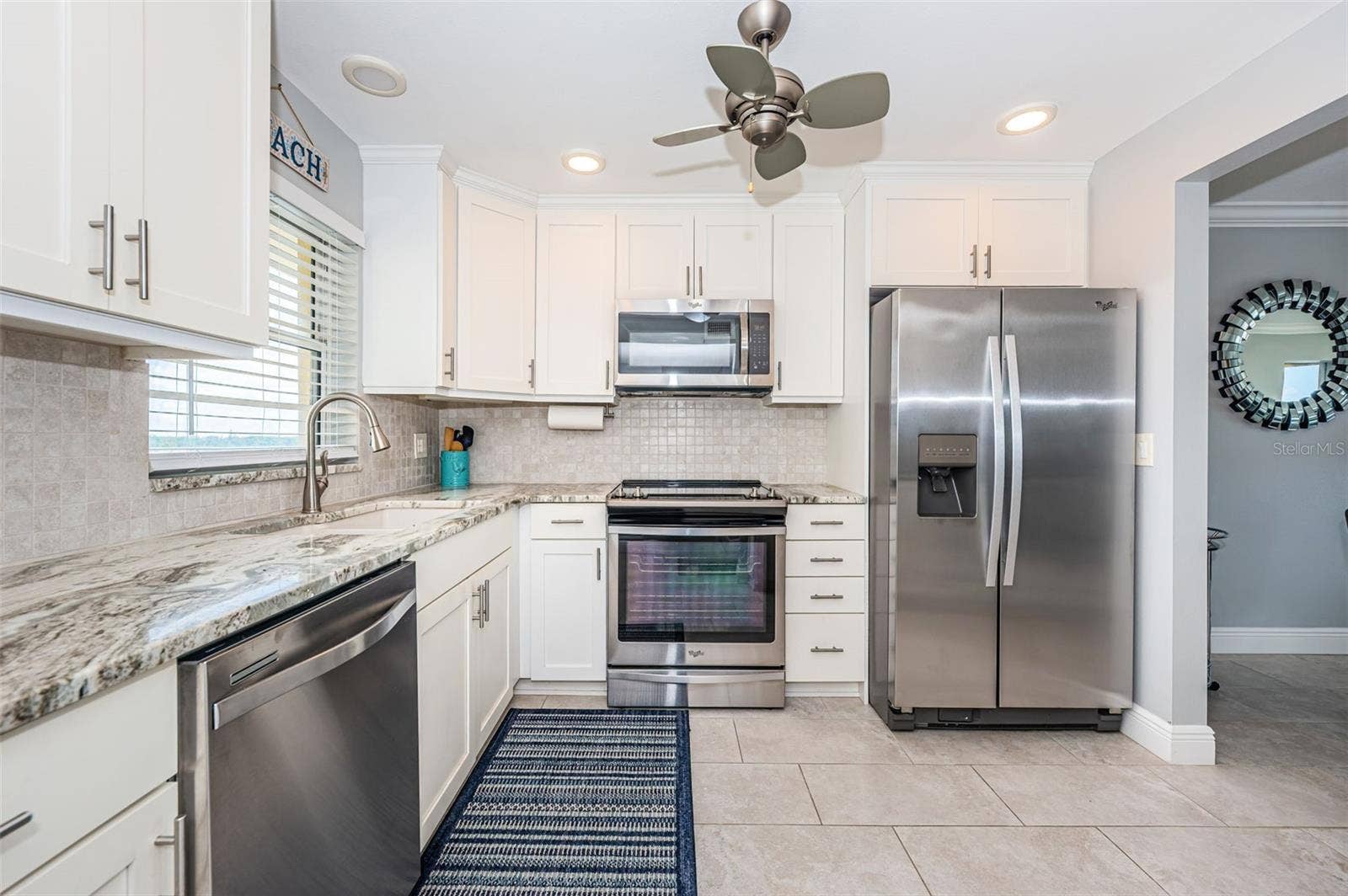 4775 COVE CIRCLE, #904, St Petersburg, FL 33708 Completely updated kitchen with granite counters, stainless appliances, new lighting and much more