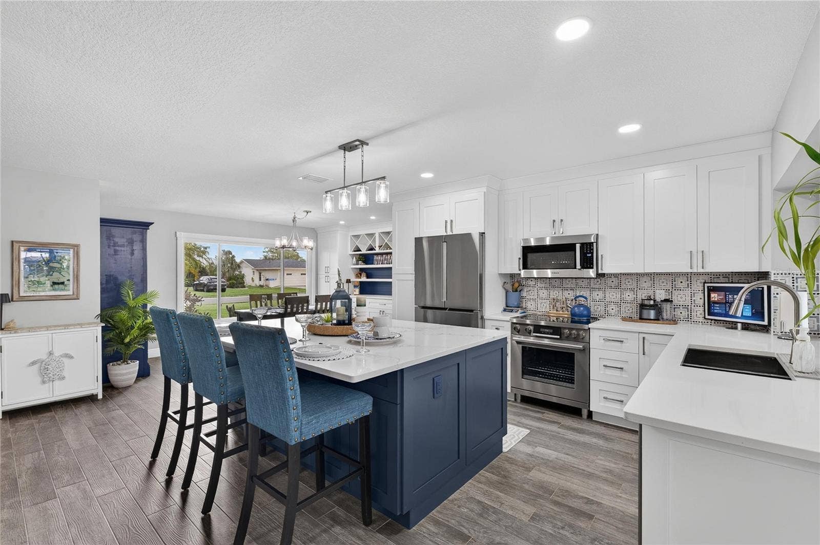 Lovely Decorative Tile Backsplash, Attractive Hardware, And "Attention To Detail" Finished Cabinet Side Panels!