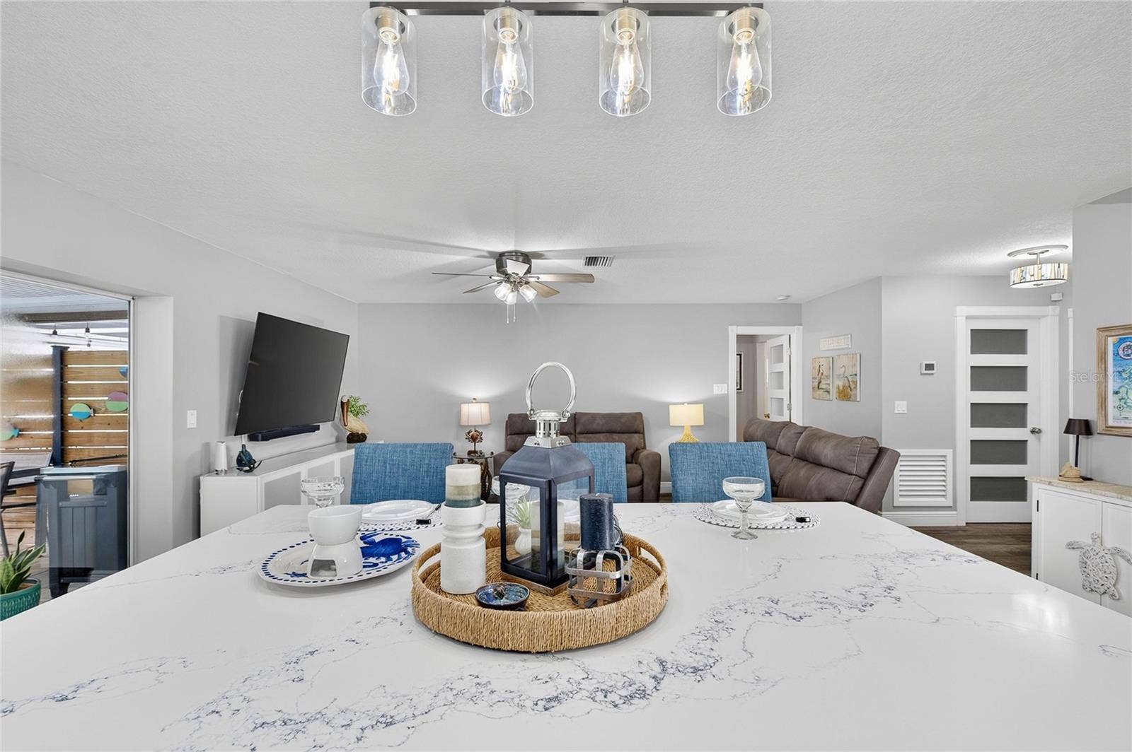 Whipping Up Dishes In The Kitchen While Easily Chatting With Guests At The Snack Bar & Living Room!