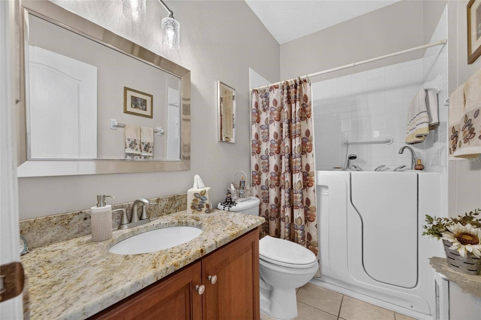 1229 HUNTINGTON GREENS DRIVE, #12, Sun City Center, FL 33573 Guest Bathroom with Walk-in Tub