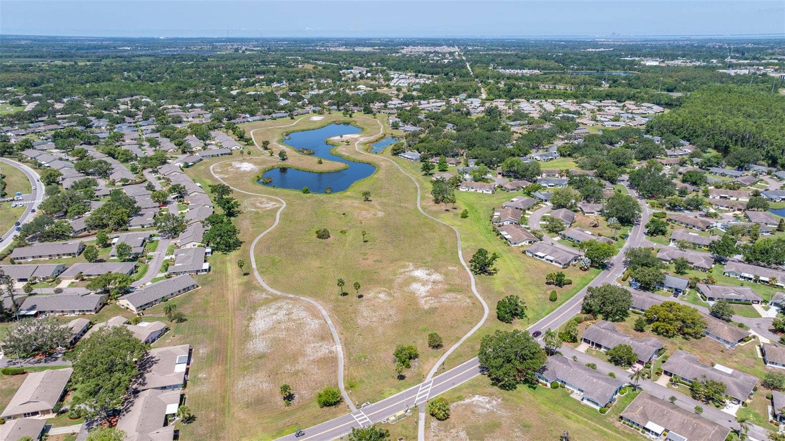 1229 HUNTINGTON GREENS DRIVE, #12, Sun City Center, FL 33573 Retired Golf course - now pedestrian greenway trails