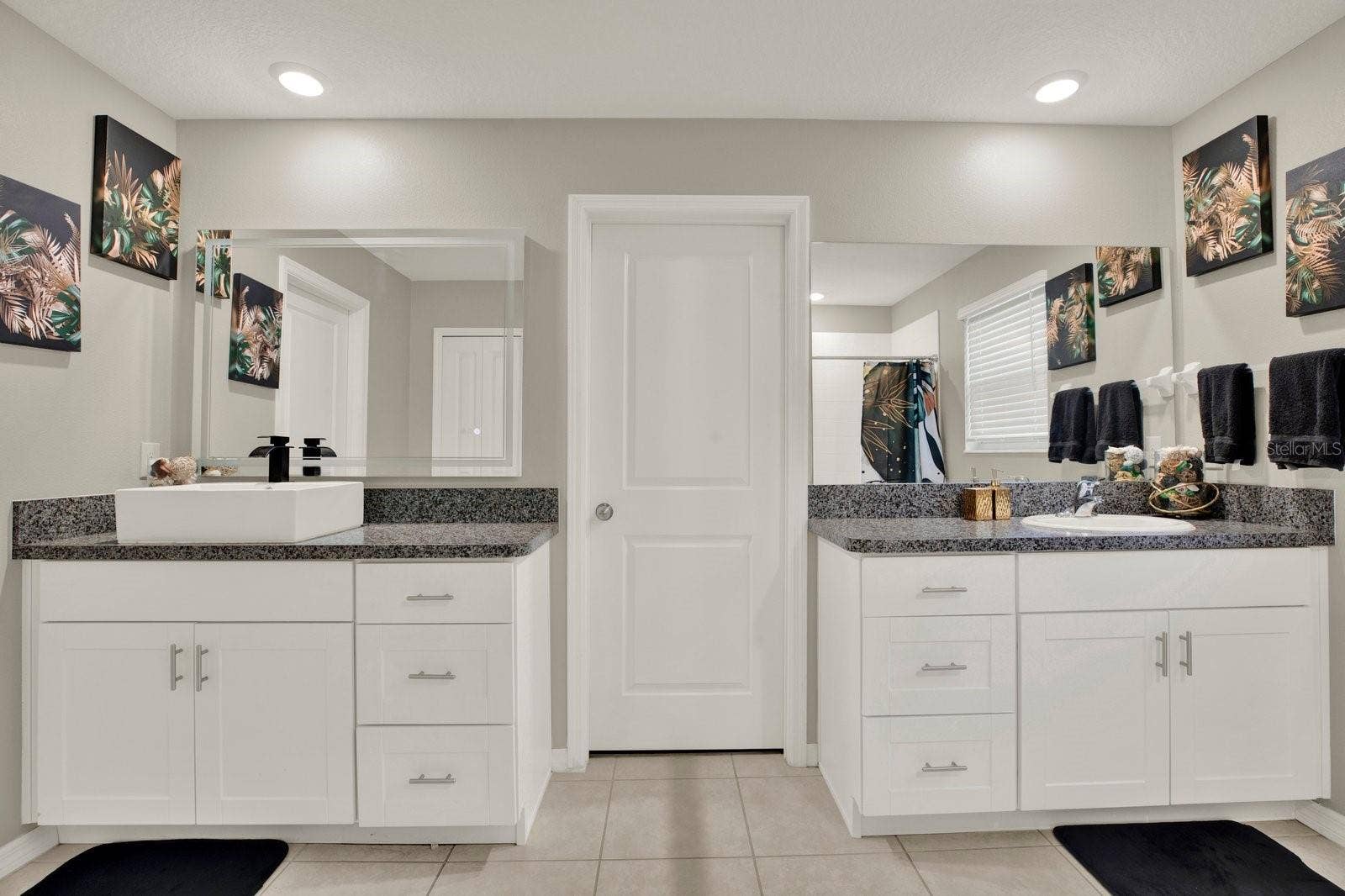 Double sink primary bedroom with shower