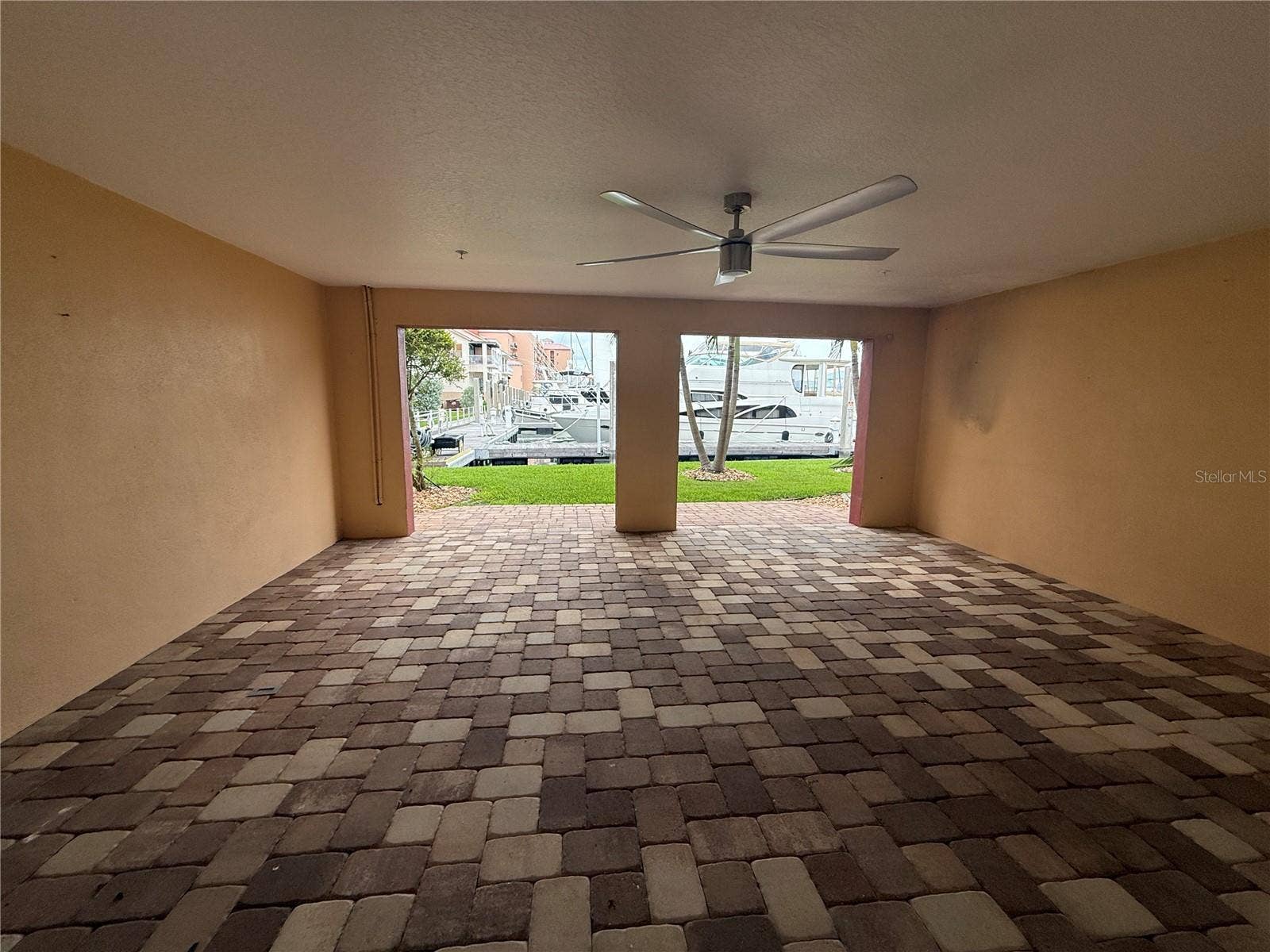 Covered Patio Facing the Water in the Rear of the