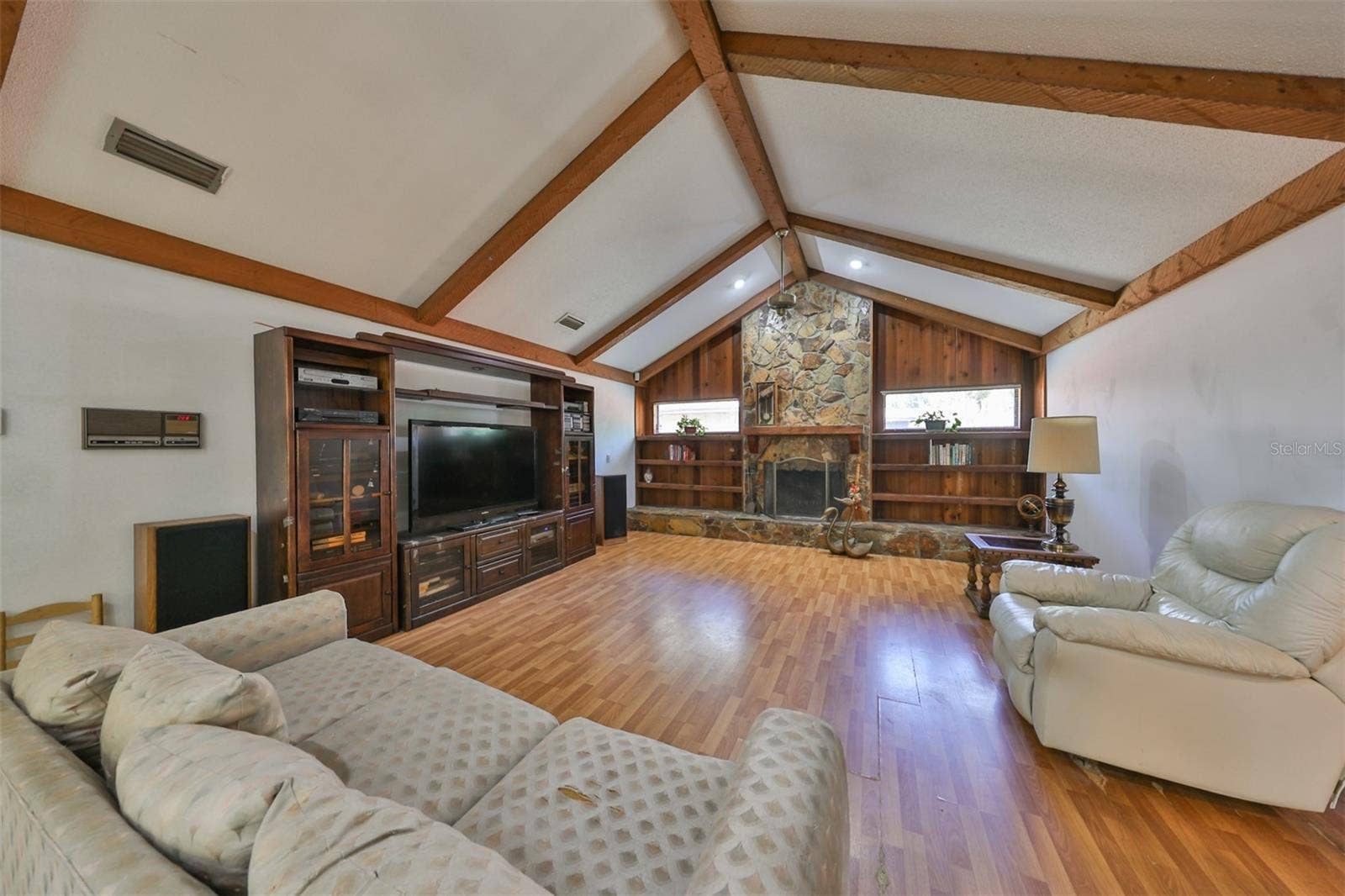 2609 MANOR OAK DRIVE, Valrico, FL 33596 Family room is HUGE with a fireplace, ceiling beams and cathedral ceilings.