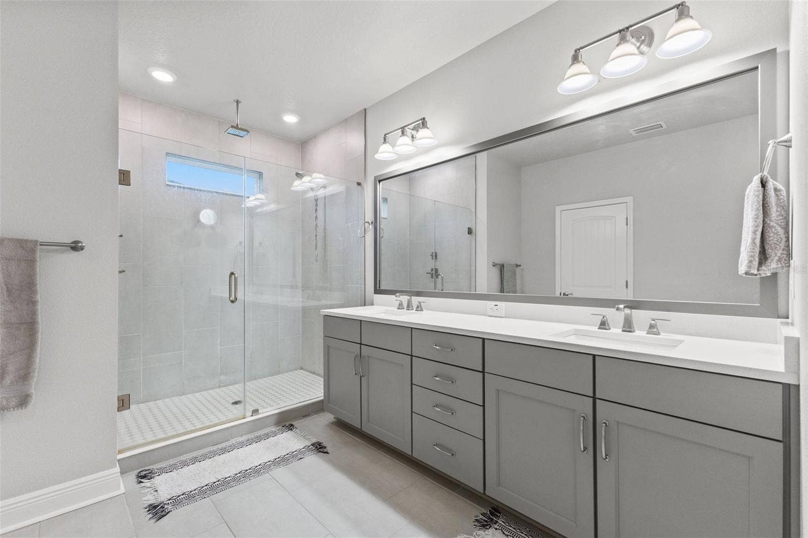 4009 W CARMEN STREET, Tampa, FL 33609 Primary bath with walk in shower and water closet