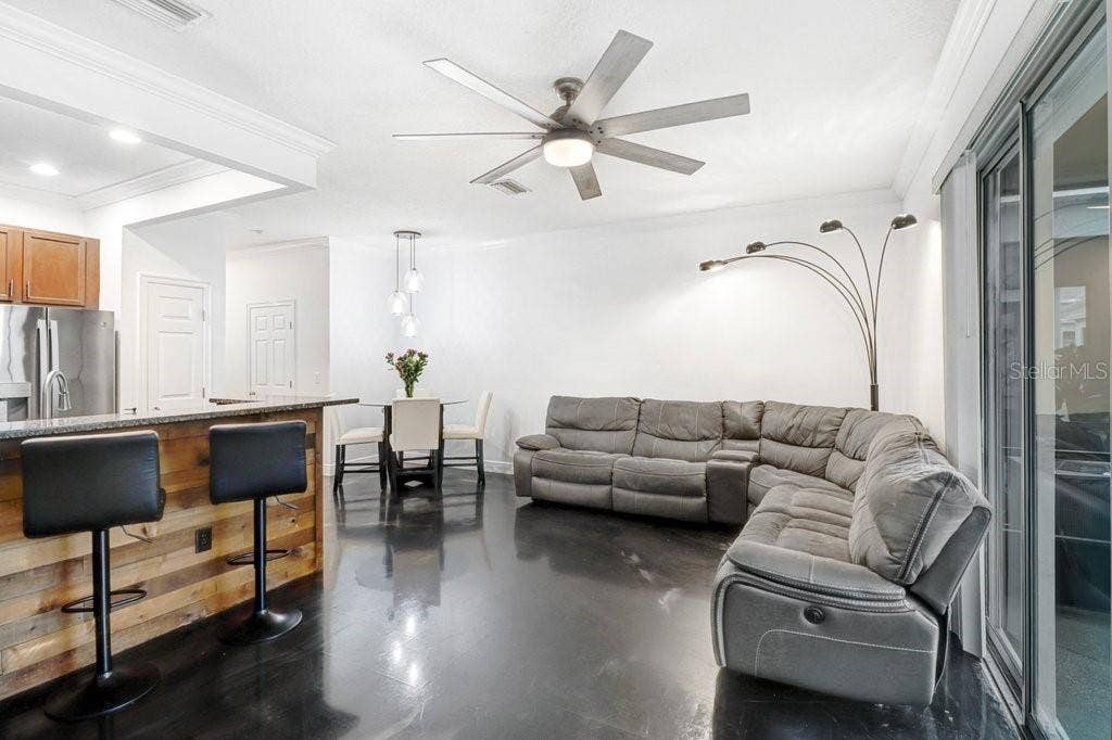 6818 46TH LANE N, Pinellas Park, FL 33781 Living Room Open to Kitchen and Dining Area