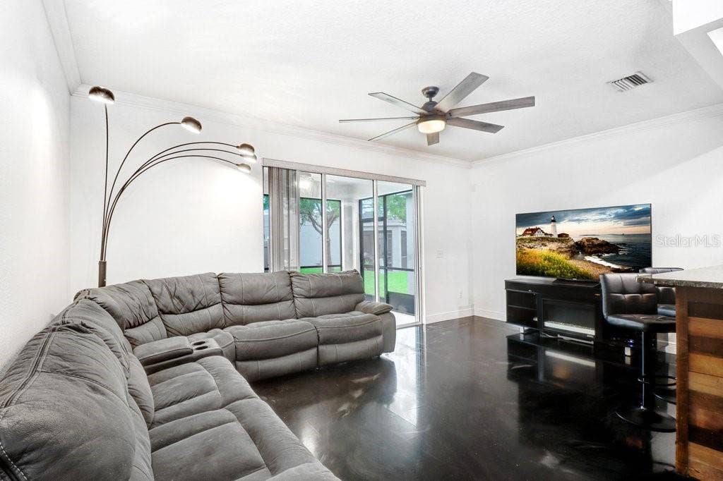 6818 46TH LANE N, Pinellas Park, FL 33781 Living Room Open to Kitchen and Dining Area