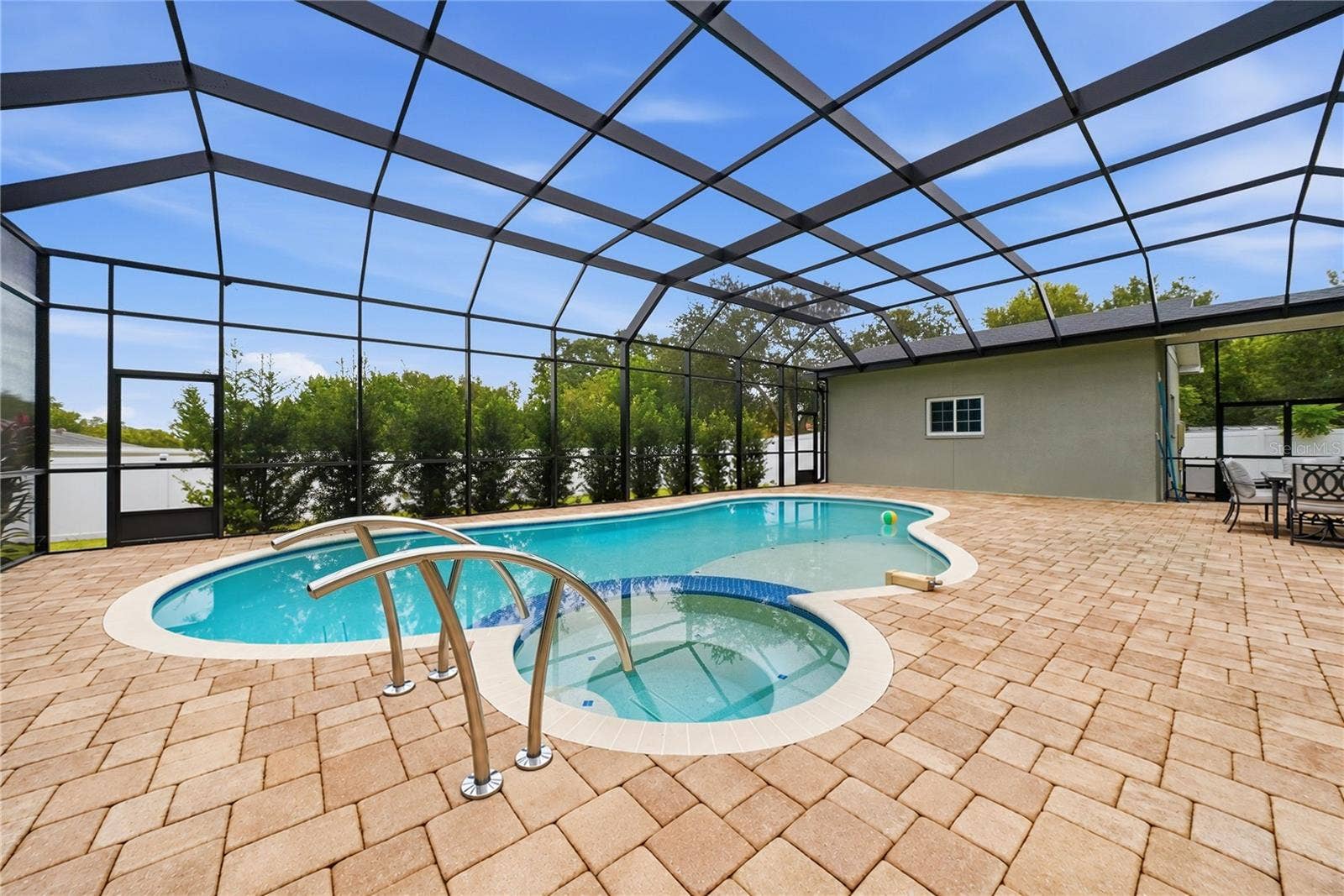 608 4TH STREET SW, Largo, FL 33770 Screened pool with stunning paver deck