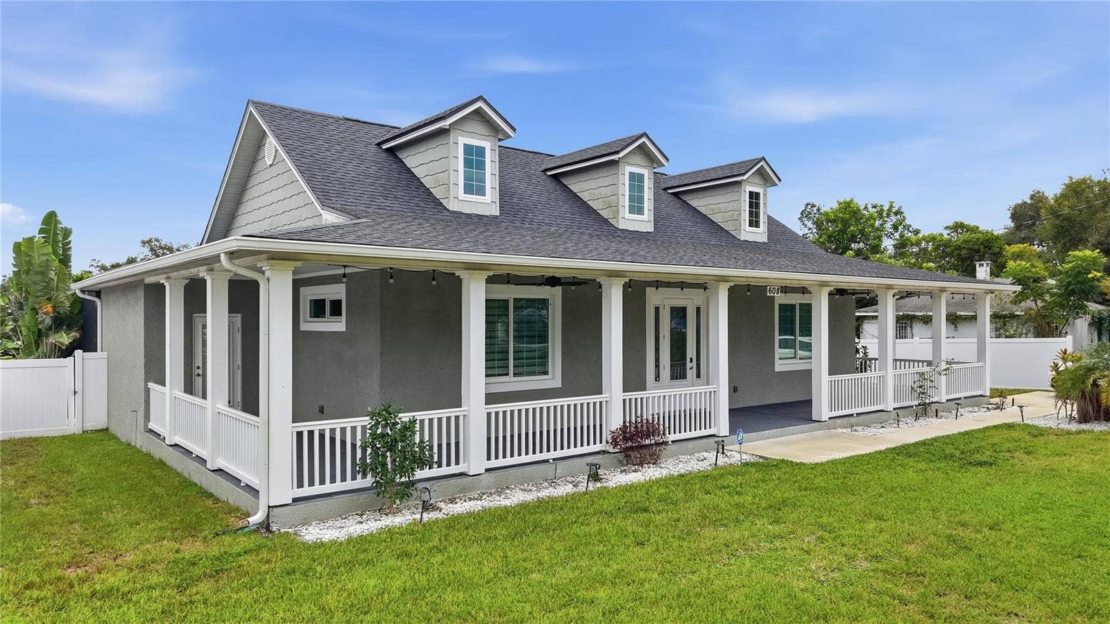 608 4TH STREET SW, Largo, FL 33770 Front of home with 1,100 sq ft wrap around porch