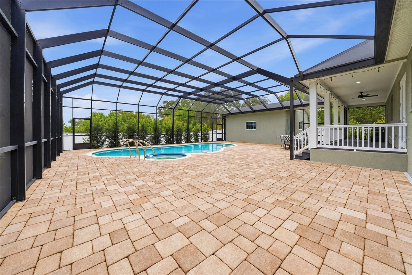 608 4TH STREET SW, Largo, FL 33770 Stunning tiled paver deck & outdoor living area