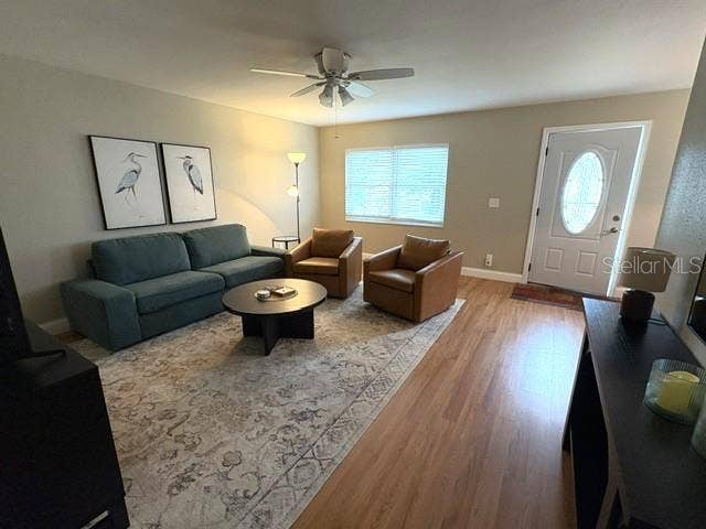 2202 CLUBHOUSE DRIVE, #173, Sun City Center, FL 33573 Living room is inviting, with good natural light through the glass insert at the front door.