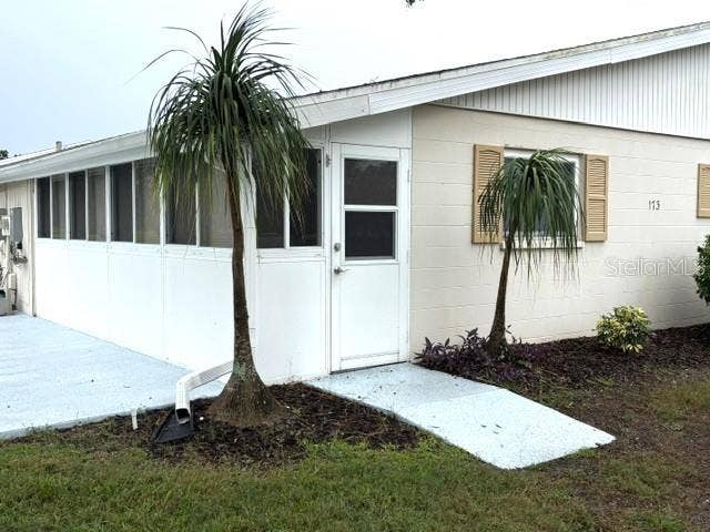 2202 CLUBHOUSE DRIVE, #173, Sun City Center, FL 33573 Back of home features with entrance to lanai.