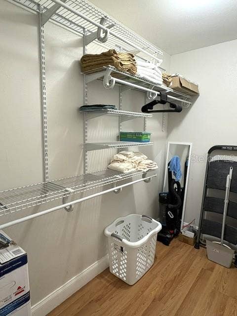 2202 CLUBHOUSE DRIVE, #173, Sun City Center, FL 33573 Walk in closet with adjustable shelving.
