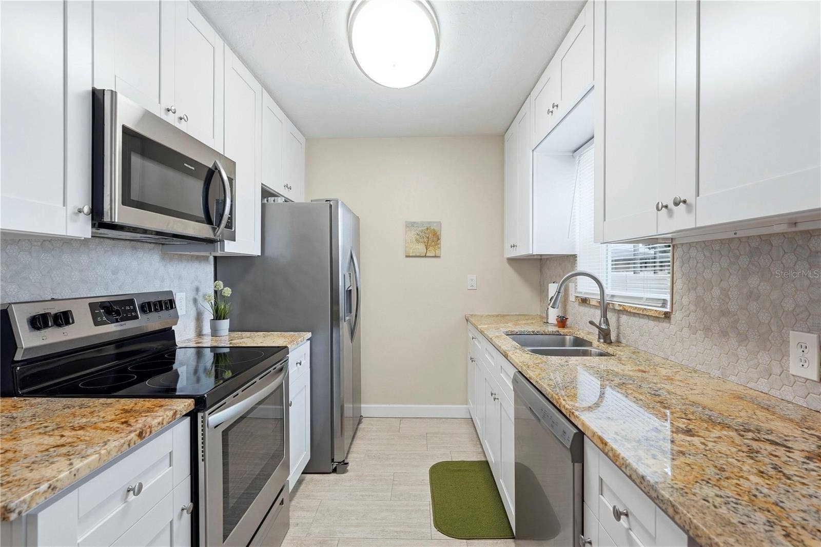 Granite Counters, Shaker Cabinets, Tile Backsplash