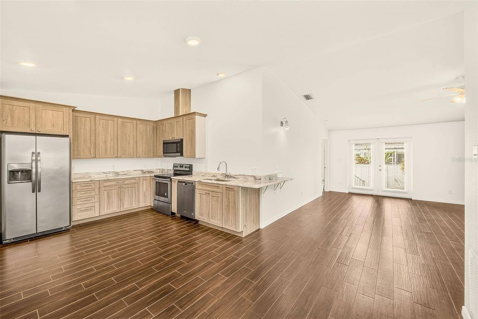 14330 CHANNEL DRIVE, Largo, FL 33774 Kitchen is open to the living room